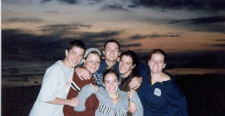Kids on the beach at sunset